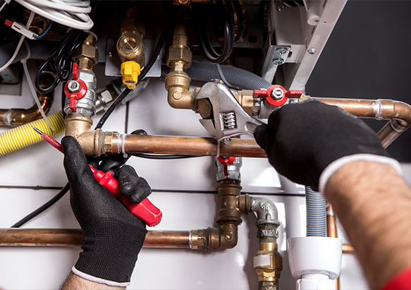 plumber fixing central heating system